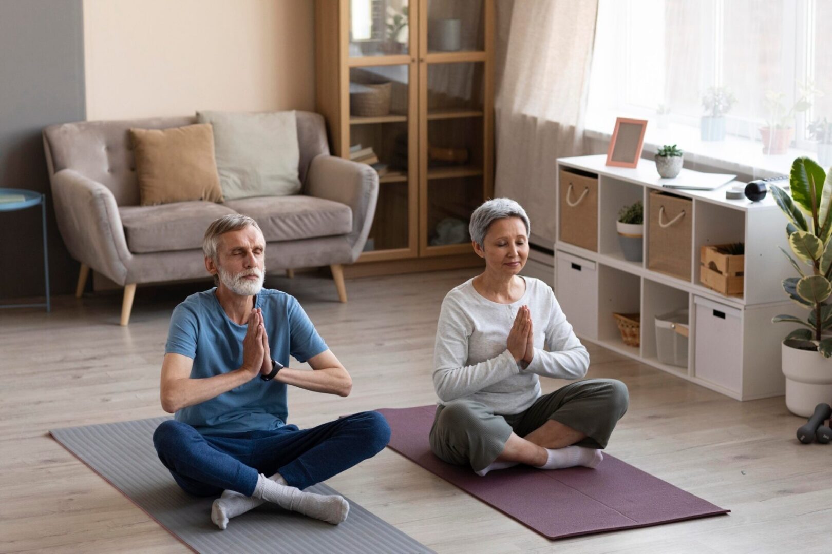 An older couple doing some yoga exercise