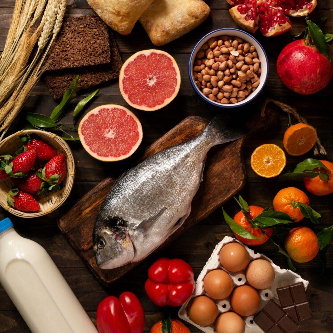 Mediterranean diet showing multiple food types such as fish, fruits and nuts