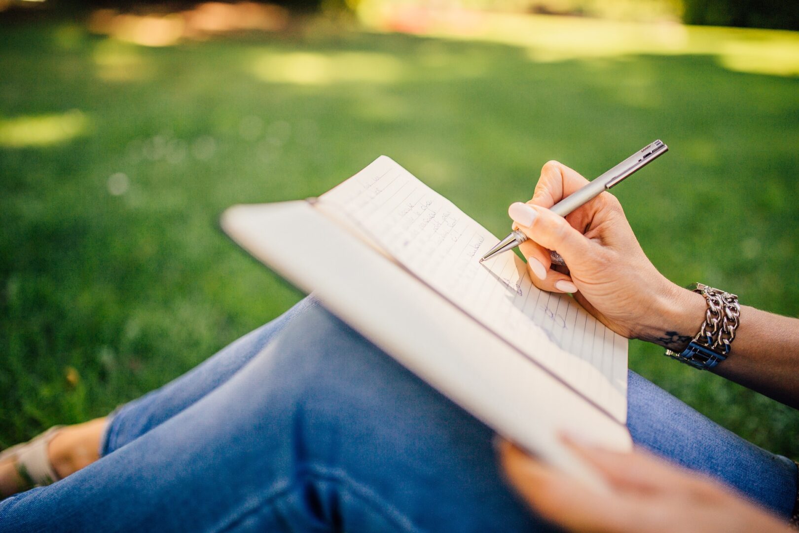 Woman sitting in park Setting Achievable Health Goals