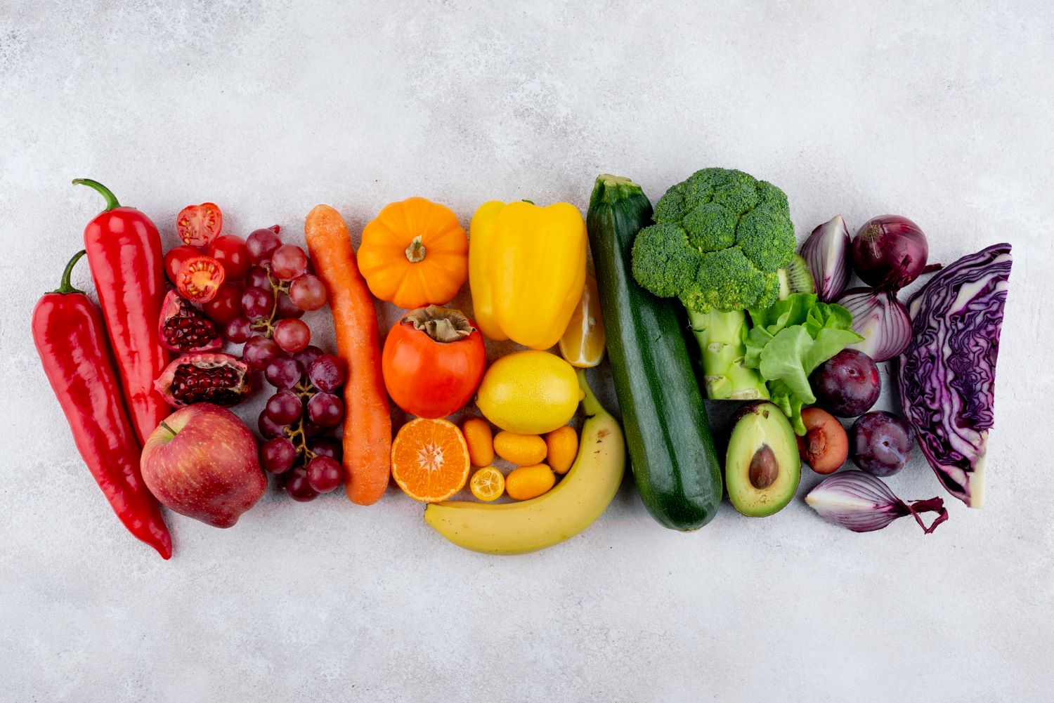 A warm, realistic photograph of a colourful Mediterranean meal on a kitchen table